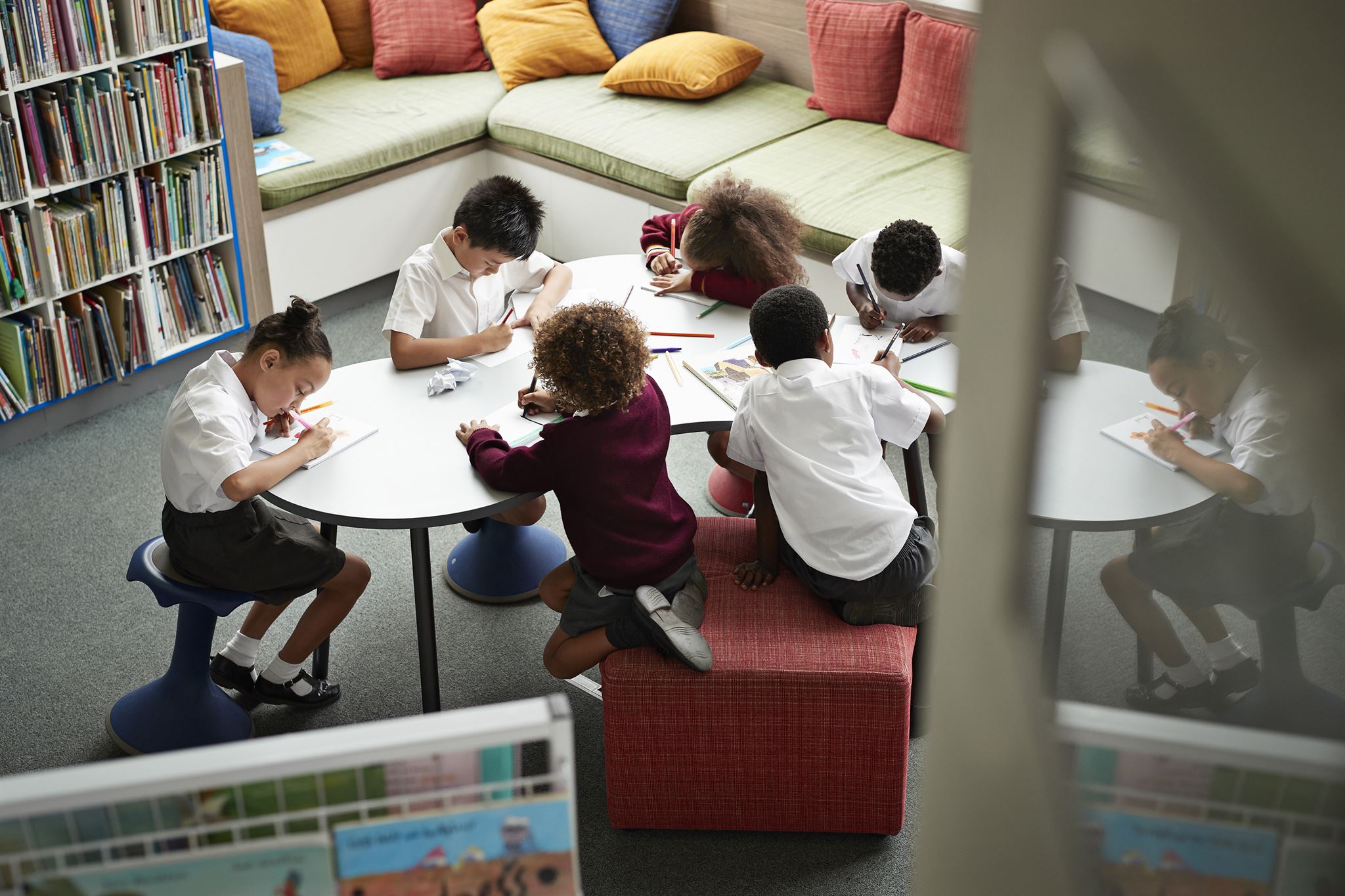 Volunteer teaching children in classroom